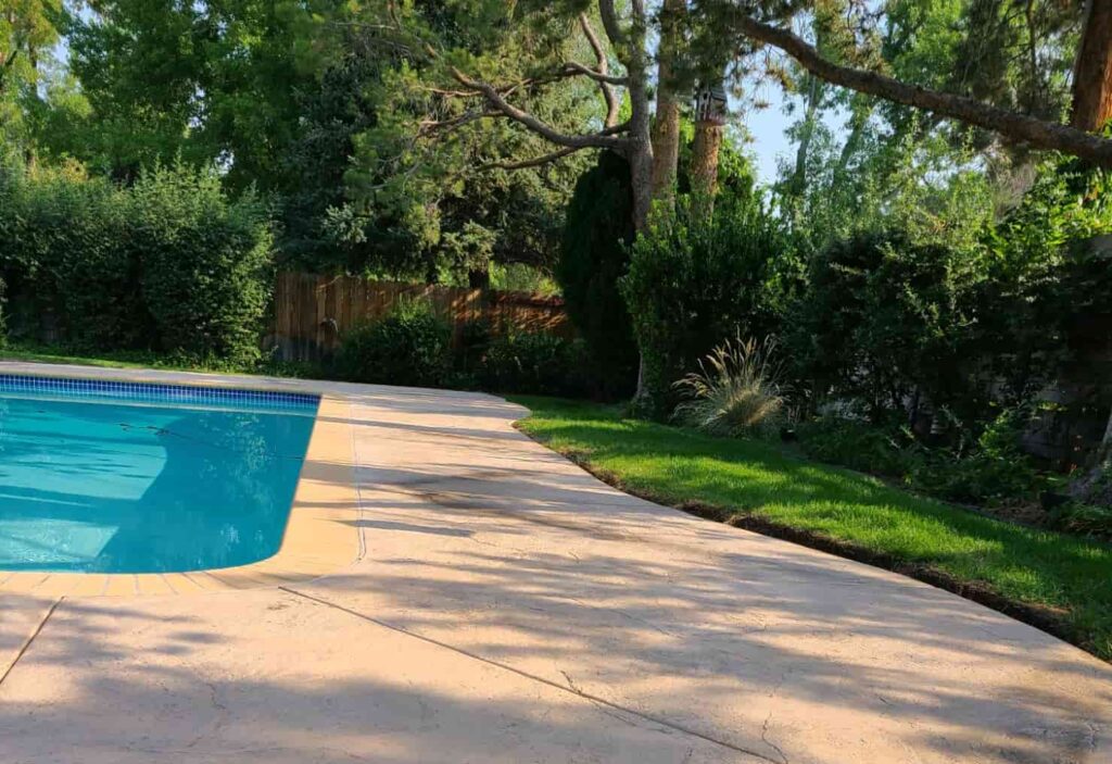 Colored Concrete pool deck stamped with texture mat